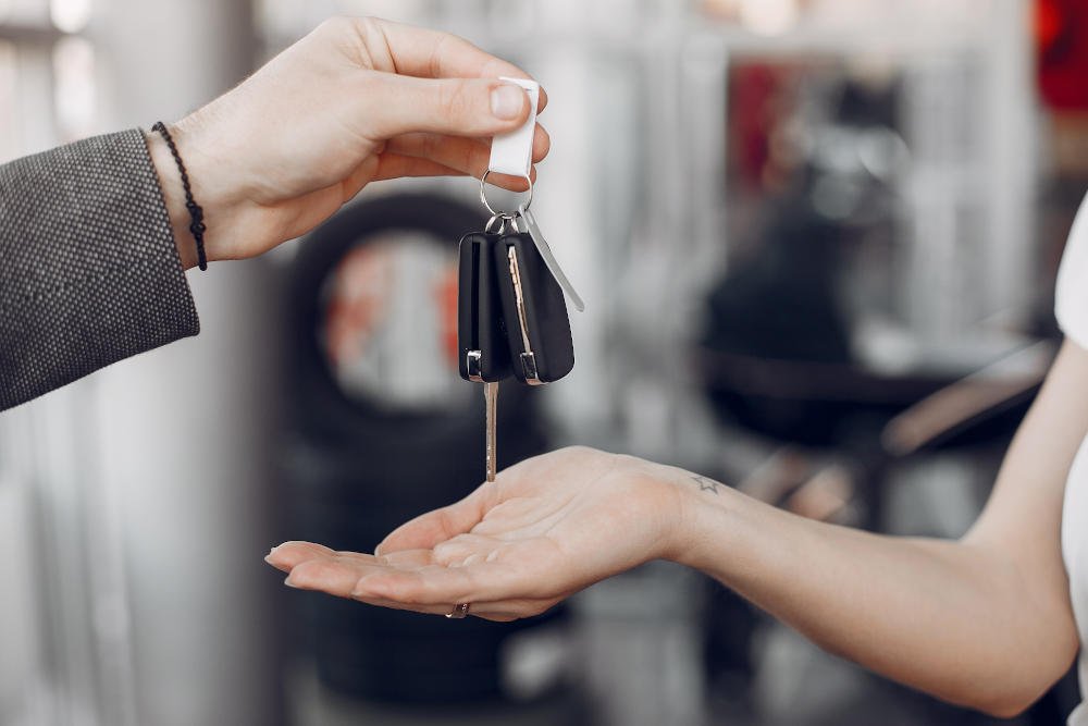 Stylish and elegant woman in a car salon